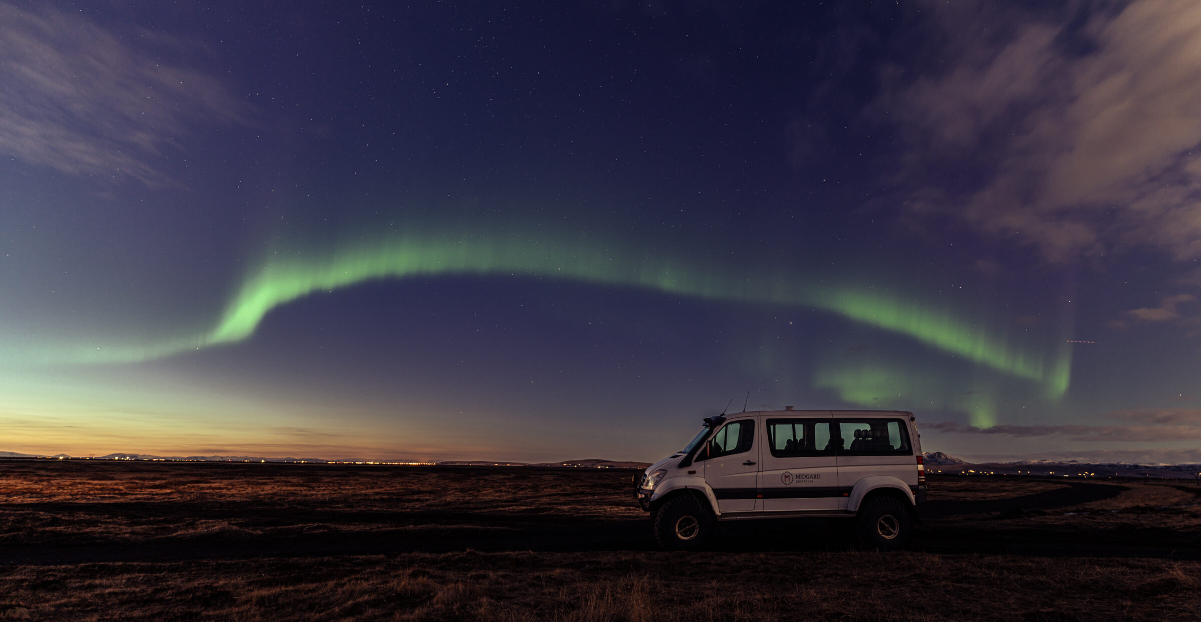Super Jeep in front of Northern Lights